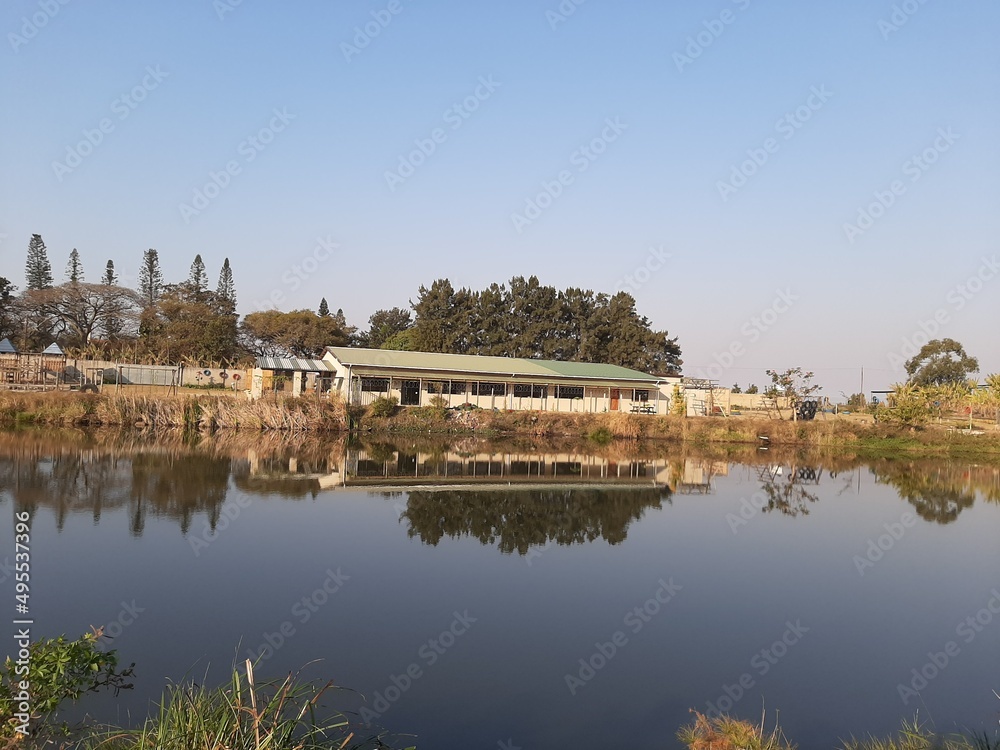 A School reflecting in a lake 
