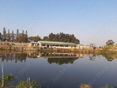 A School reflecting in a lake  © Francois