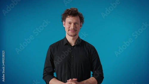 Fashion happy business male pointing forefinger exactly idea gesture posing isolated blue studio