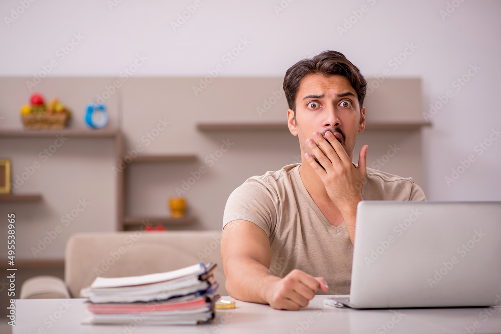 Young male employee working from house Young male employee working from house