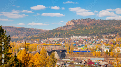 Autumn taiga landscape with bridge over the Lena River in Ust-Kut.