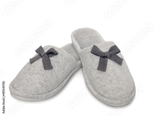 Soft cozy women's home slippers isolated on a white background. Comfortable home shoes. Hotel bath slippers