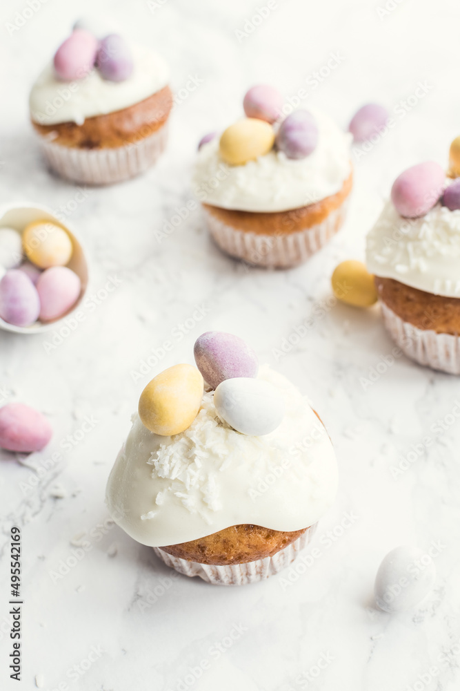 Glazed Easter cupcakes decorated with mini chocolate eggs