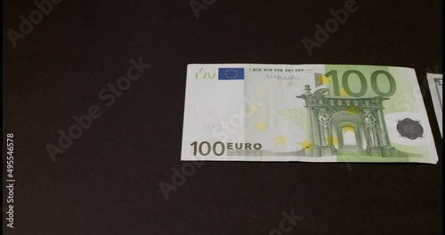 One hundred US Dollar and 100 Euro banknotes. European currency and US currency