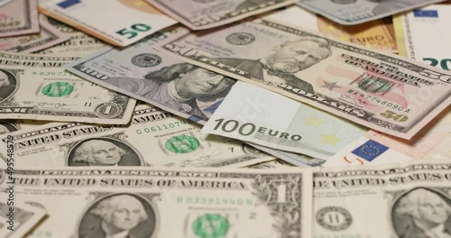 US Dollar banknotes on top of Euro banknotes. Forex exchange of USD and EUR