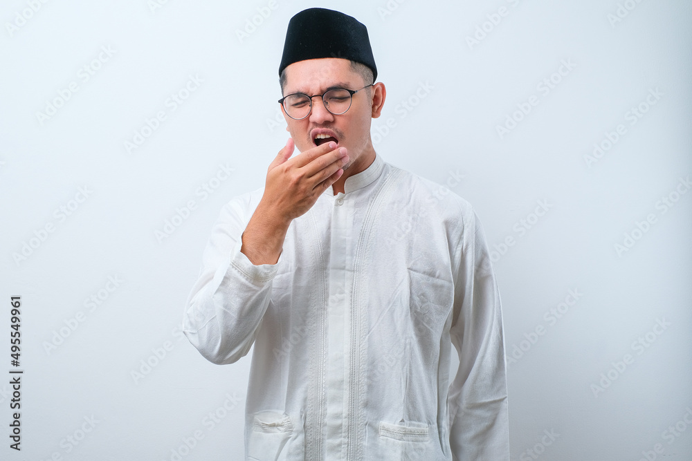 Asian muslim man having bad breath problem during fasting in ramadan moth Asian muslim man having bad breath problem during fasting in ramadan moth
