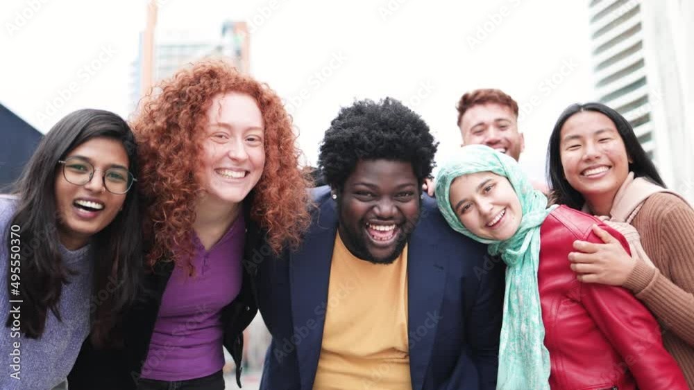 Multiracial happy friends having fun outdoor in the city - People from different race and cultures