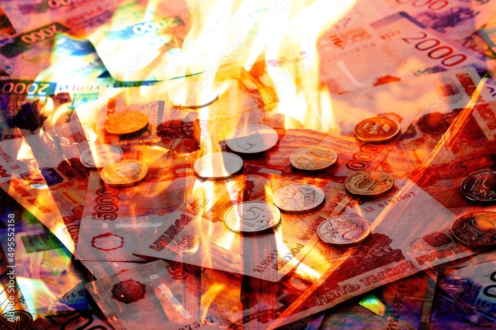 Background of russian rubles with fire flames Background of russian rubles with fire flames