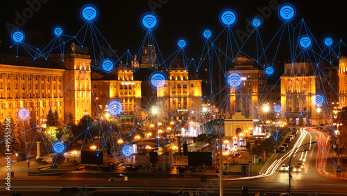 View of beautiful night city and signs of wi-fi