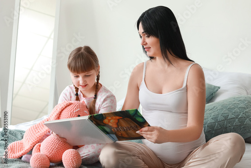 Pregnant mother and daughte...