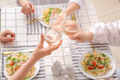 Friends toasting with white...