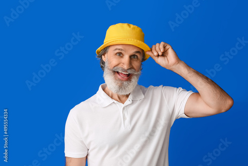 Stylish mature man on color...