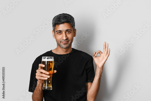 Handsome man with glass of ...