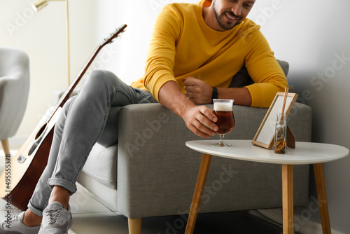 Handsome man drinking beer ...