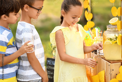 Cute children buying lemona...
