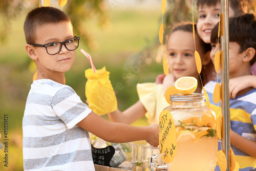 Cute children selling lemon...