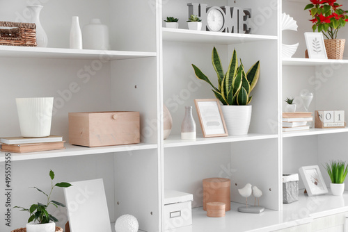 Shelf unit with beautiful decor in room photo