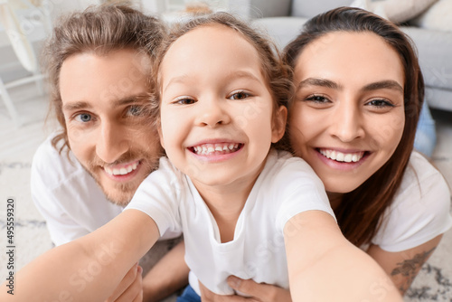 Happy young family taking s...