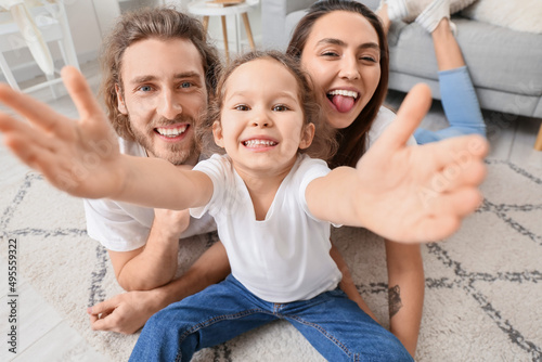 Happy young family taking s...