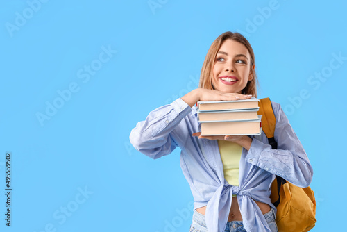 Female student with books o...