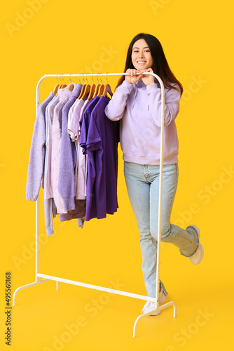 Young Asian woman and rack ...
