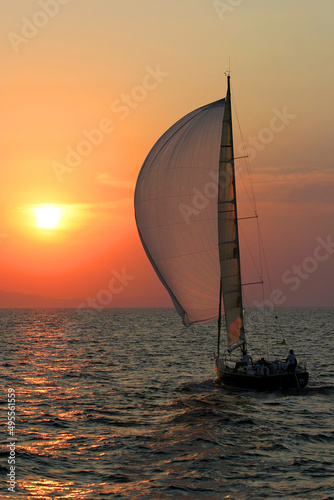 Sailing boat at sunset in Aegean Sea, Turkey.