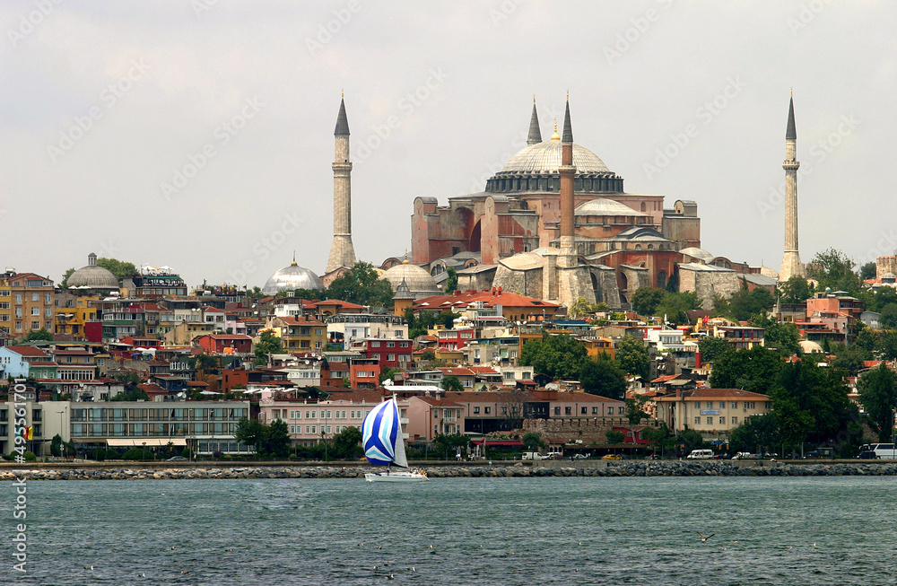Sailing boat at Bosphorus with Hagia Sofia in Istanbul, Turkey. 