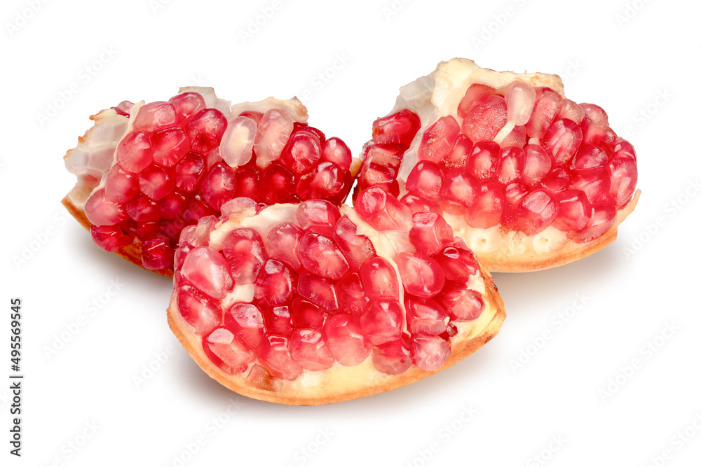 Fresh juicy pomegranate in cut pieces isolated on white background. Clipping path. Fresh juicy pomegranate in cut pieces isolated on white background. Clipping path.