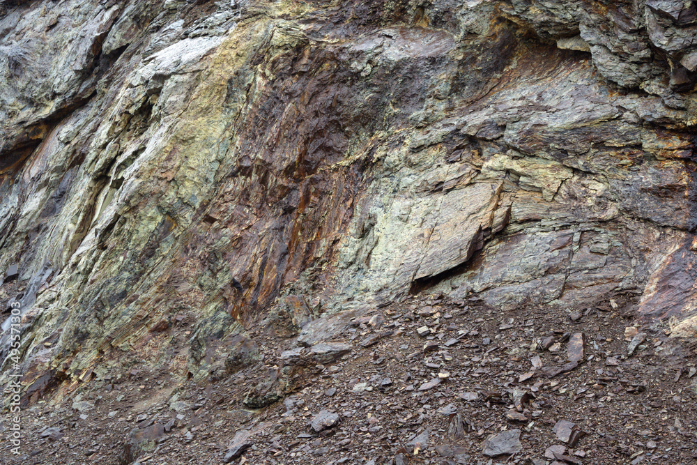 Huge stones with cracks. Texture and background. Old abandoned huge coal pit.  Ruins and stones. Ruins and huge mountains of dirty rock.