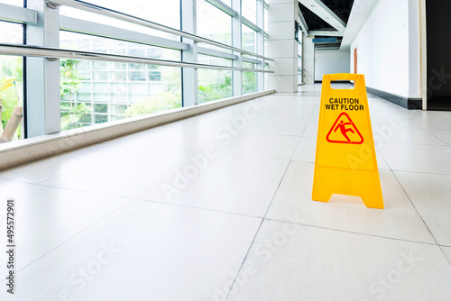 Sign showing warning of wet floor photo