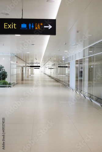 A view inside the airport during the pandemic. Absence of people at the airport. Vertical photo.