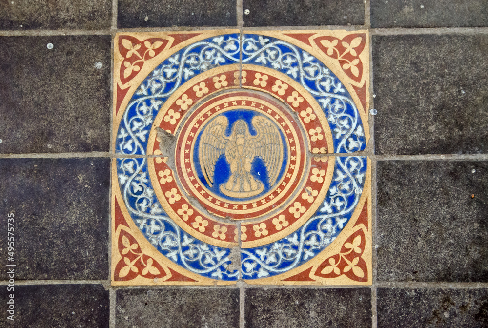 Victorian floor tiles showing the Christian symbol of a pelican feeding her young