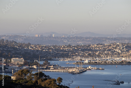 Looking over the skyline of Downtown San Diego, Naval Air Station North Island and the Peninsular Ranges in the distance from Point Loma