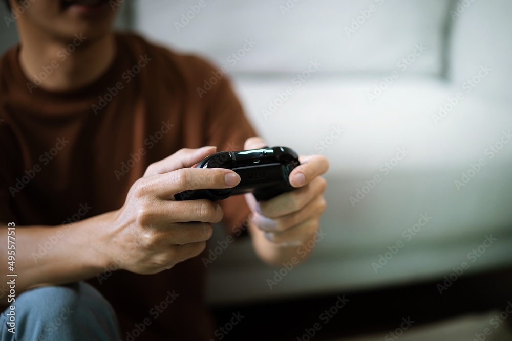 Young Asian man gamer controller video console playing holding hobby playful Online Video Game enjoyment eSport Cyber Games Internet. Young Asian man gamer controller video console playing holding hobby playful Online Video Game enjoyment eSport Cyber Games Internet.