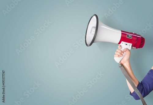Attention. hand holds loudspeaker which is symbol of advertising,  announcement, warning and advertising concept.