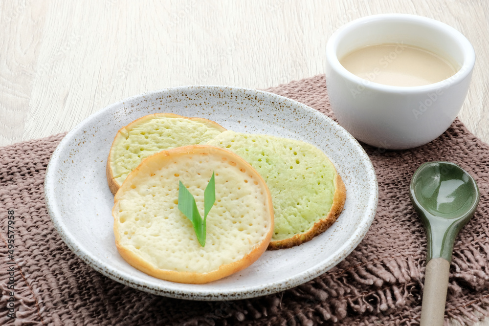 Serabi or Surabi, Indonesian pancake made of flour, rice flour and coconut milk. Served with palm sugar sauce. Sweet and savory.
Serabi or Surabi, Indonesian pancake made of flour, rice flour and coconut milk. Served with palm sugar sauce. Sweet and savory.