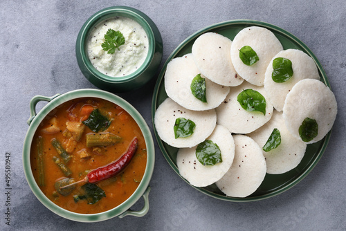  Traditional breakfast of South India Idly served with sambar Chutney in a ceramic plate photo