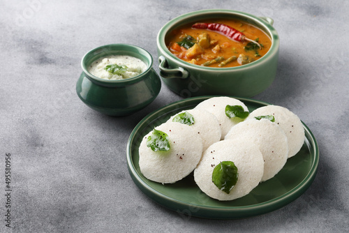  Traditional breakfast of South India Idly served with sambar Chutney in a ceramic plate photo