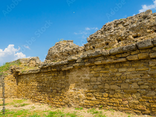 Belgorod Dniester fortress. The ruins of medieval Akkerman Fortress, Bilhorod Dnistrovskyi, Ukraine. Ruins of the citadel. Exteriors of the stronghold on a sunny summer day. photo