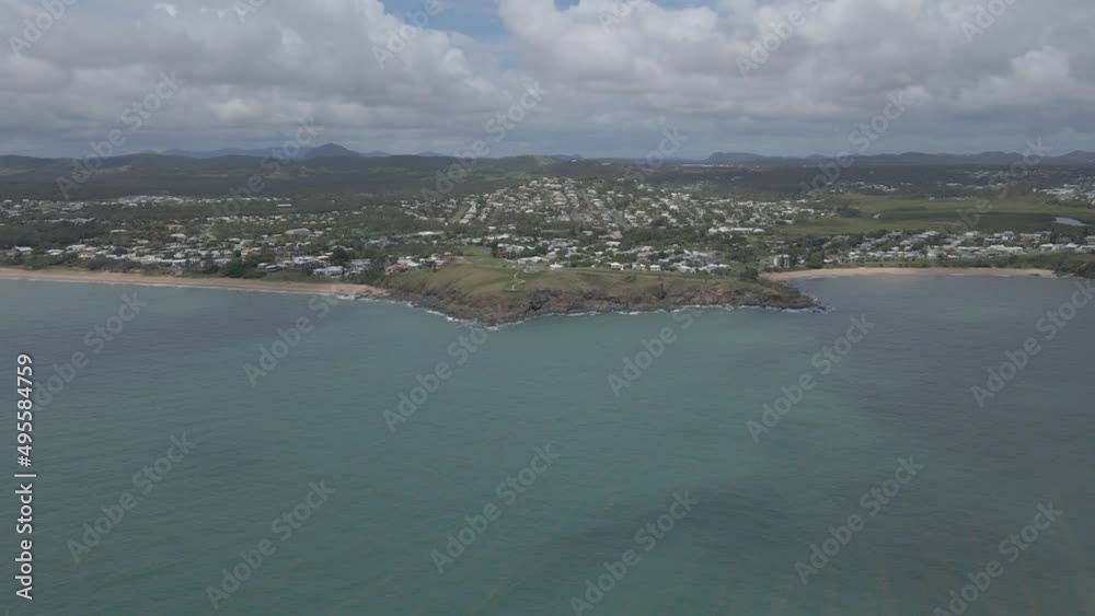 Wreck Point Scenic Lookout And Cooee Bay Beach With Picturesque Seascape Scenery In Queensland, Australia. wide aerial Wreck Point Scenic Lookout And Cooee Bay Beach With Picturesque Seascape Scenery In Queensland, Australia. wide aerial