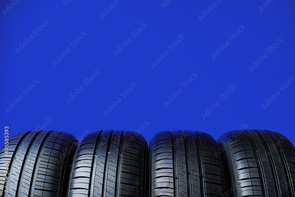 Group of tires on a blue background Group of tires on a blue background