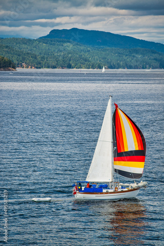 Small sailboat sails in the British Columbia Sound.