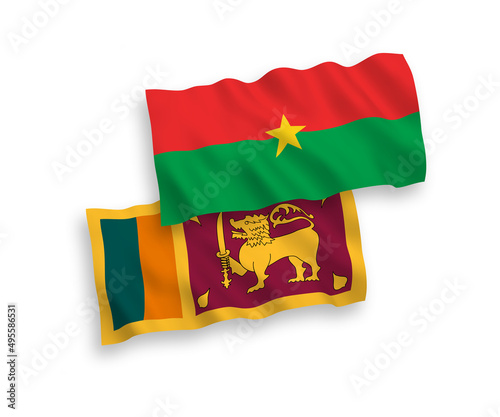 National vector fabric wave flags of Sri Lanka and Burkina Faso isolated on white background. 1 to 2 proportion.