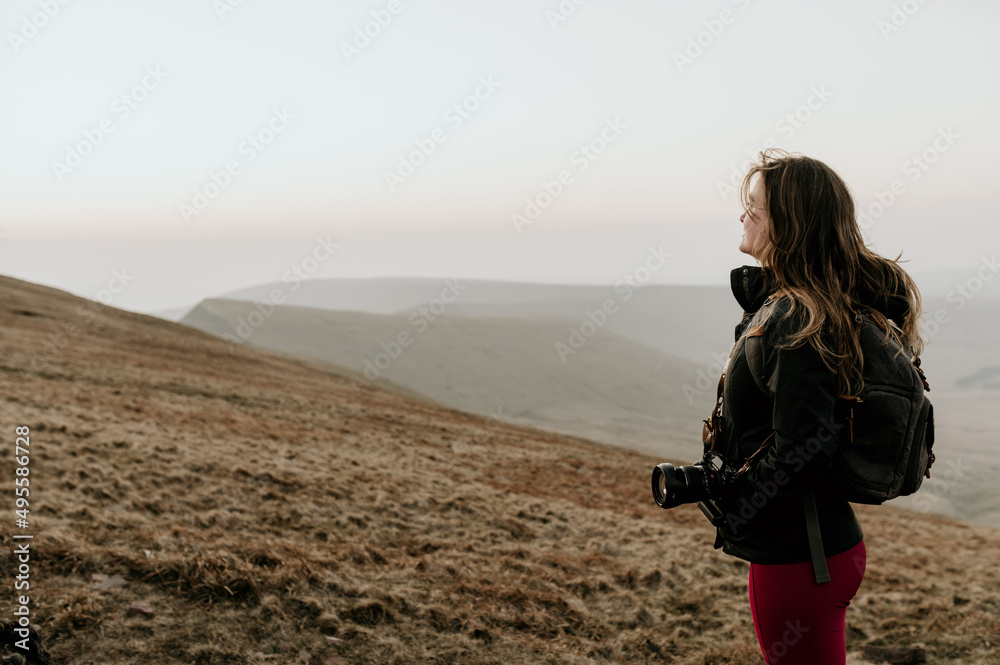 woman with camera on the mountainside