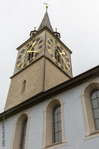 spire of St. Peter church in Zurich with large clock face