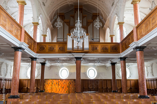 symmetric view on nave of St. Peter church in Zurich with organ pipe photo