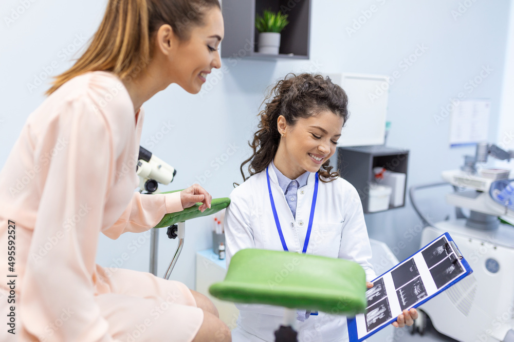 Obraz premium Treatment of cervical disease. Female gynecologist unrecognizable woman patient in gynecological chair during gynecological check up. Gynecologist examines a woman. Diagnostic, medical service.