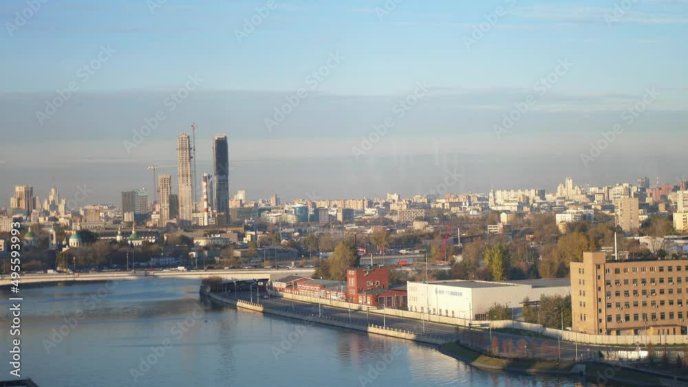 Beautiful view of the Moskva River and distant skyscrapers of a financial district Beautiful view of the Moskva River and distant skyscrapers of a financial district