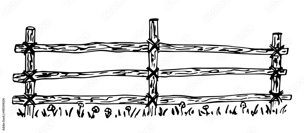 Rustic old wooden fence made of logs. Grass and flowers. Ranch