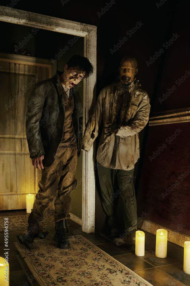 Zombie house with candlelight and scary corpse Zombie house with candlelight and scary corpse